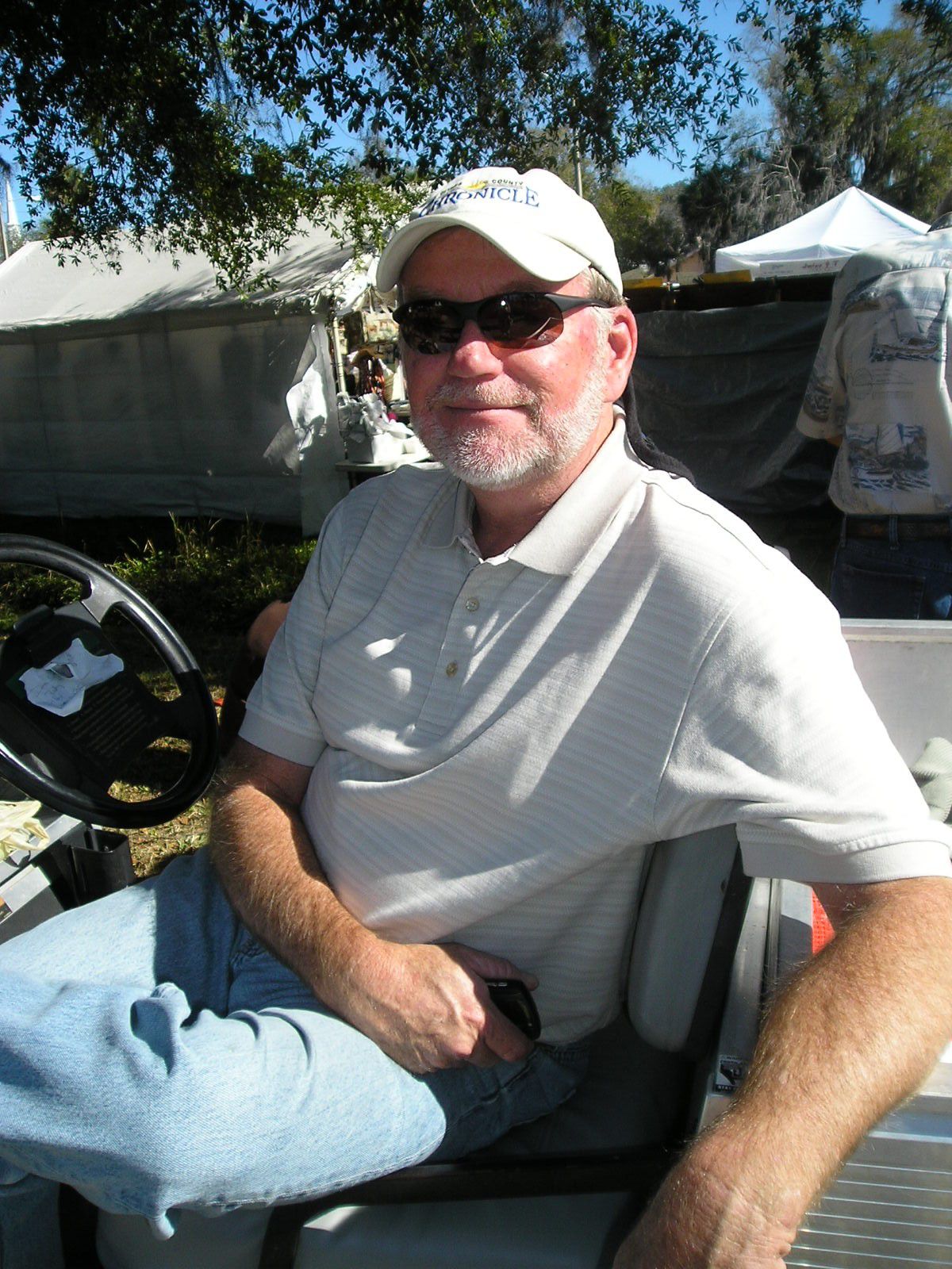 Gerry Mulligan riding in golf cart at fest.jpg